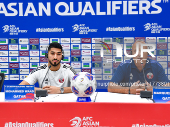 Qatar national team head coach Marquez Lopez (R) and player Mohammed Waad (L) attend a press conference at Jassim Bin Hamad Stadium in Doha,...