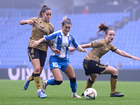 Nahia Aparicio and Ane Etxezarreta of Real Sociedad compete for the ball with Millene Cabral of RC Deportivo Abanca during the Liga F match...