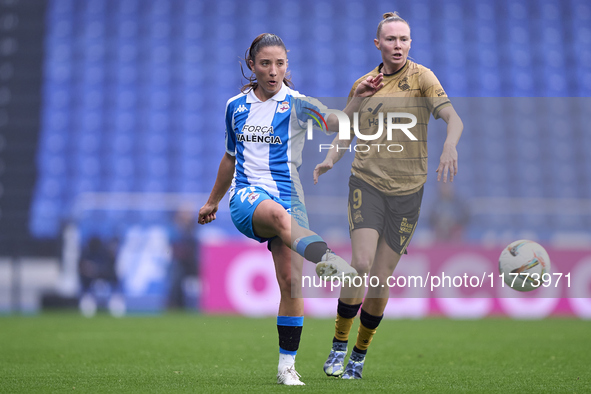 Lucia Martinez Gonzalez of RC Deportivo Abanca is challenged by Sanni Franssi of Real Sociedad during the Liga F match between RC Deportivo...