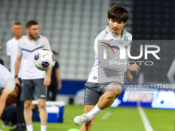 Hojimat Erkinov from the Uzbekistan National football team attends a training session at Jassim Bin Hamad Stadium in Doha, Qatar, on Novembe...