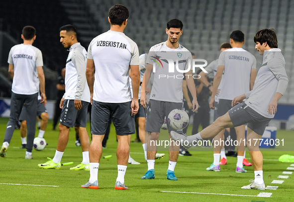 Players of the Uzbekistan national team train at Jassim Bin Hamad Stadium in Doha, Qatar, on November 13, 2024, ahead of the FIFA World Cup...