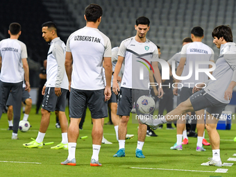 Players of the Uzbekistan national team train at Jassim Bin Hamad Stadium in Doha, Qatar, on November 13, 2024, ahead of the FIFA World Cup...