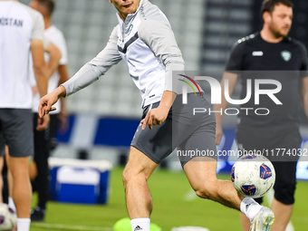 Hojimat Erkinov from the Uzbekistan National football team attends a training session at Jassim Bin Hamad Stadium in Doha, Qatar, on Novembe...