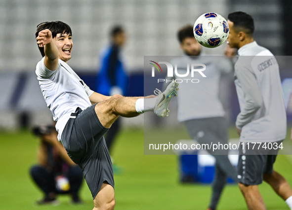 Hojimat Erkinov from the Uzbekistan National football team attends a training session at Jassim Bin Hamad Stadium in Doha, Qatar, on Novembe...