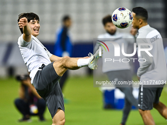 Hojimat Erkinov from the Uzbekistan National football team attends a training session at Jassim Bin Hamad Stadium in Doha, Qatar, on Novembe...