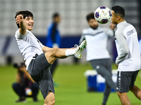 Hojimat Erkinov from the Uzbekistan National football team attends a training session at Jassim Bin Hamad Stadium in Doha, Qatar, on Novembe...