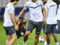 Hojimat Erkinov (L) and Abdukodir Khusanov from the Uzbekistan National football team attend a training session at Jassim Bin Hamad Stadium...