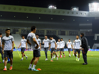 Players of the Uzbekistan national team train at Jassim Bin Hamad Stadium in Doha, Qatar, on November 13, 2024, ahead of the FIFA World Cup...