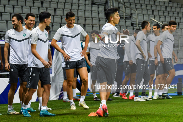 Players of the Uzbekistan national team train at Jassim Bin Hamad Stadium in Doha, Qatar, on November 13, 2024, ahead of the FIFA World Cup...