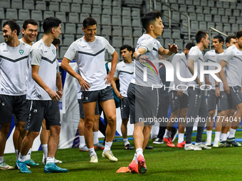 Players of the Uzbekistan national team train at Jassim Bin Hamad Stadium in Doha, Qatar, on November 13, 2024, ahead of the FIFA World Cup...