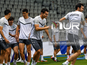 Players of the Uzbekistan national team train at Jassim Bin Hamad Stadium in Doha, Qatar, on November 13, 2024, ahead of the FIFA World Cup...