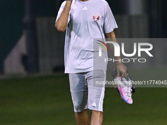 Akram Afif from the Qatar National football team attends a training session at Aspire Academy in Doha, Qatar, on November 13, 2024, ahead of...