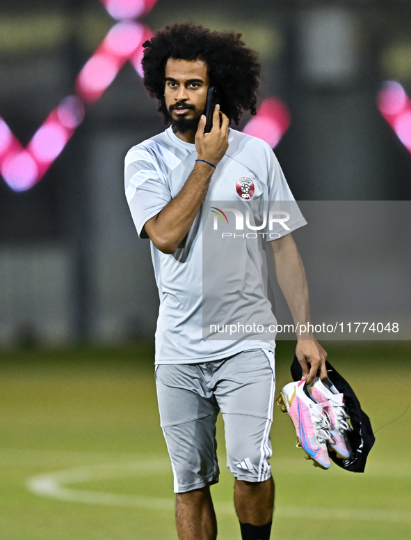 Akram Afif from the Qatar National football team attends a training session at Aspire Academy in Doha, Qatar, on November 13, 2024, ahead of...