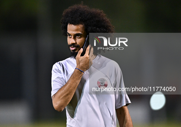 Akram Afif from the Qatar National football team attends a training session at Aspire Academy in Doha, Qatar, on November 13, 2024, ahead of...