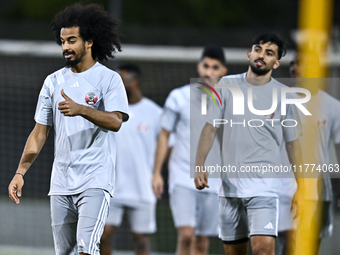 Players of the Qatar national team train at Aspire Academy in Doha, Qatar, on November 13, 2024, ahead of the FIFA World Cup 2026 Qualificat...