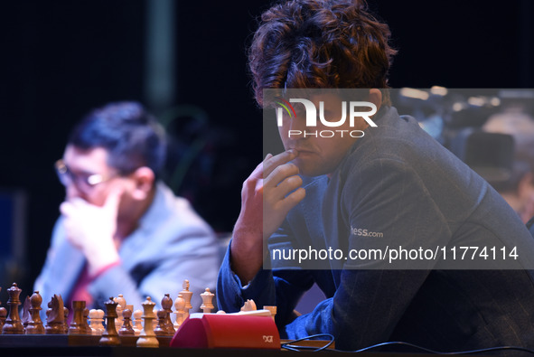 Chess player Magnus Carlsen from Norway, a five-time World Chess Champion, competes against Rameshbabu Praggnanandhaa on the first day of th...