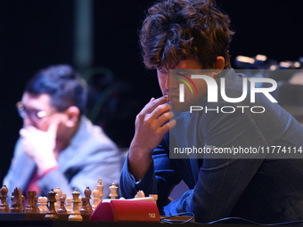 Chess player Magnus Carlsen from Norway, a five-time World Chess Champion, competes against Rameshbabu Praggnanandhaa on the first day of th...