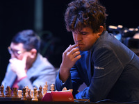 Chess player Magnus Carlsen from Norway, a five-time World Chess Champion, competes against Rameshbabu Praggnanandhaa on the first day of th...