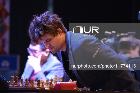 Chess player Magnus Carlsen from Norway, a five-time World Chess Champion, competes against Rameshbabu Praggnanandhaa on the first day of th...