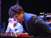 Chess player Magnus Carlsen from Norway, a five-time World Chess Champion, competes against Rameshbabu Praggnanandhaa on the first day of th...