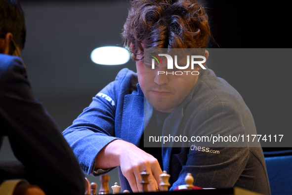 Chess player Magnus Carlsen from Norway, a five-time World Chess Champion, competes against Rameshbabu Praggnanandhaa on the first day of th...