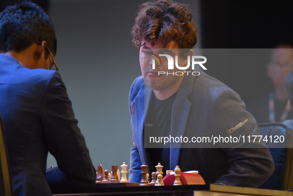 Chess players Rameshbabu Praggnanandhaa of India and Magnus Carlsen of Norway, a five-time World Chess Champion, compete on the first day of...