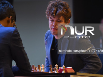 Chess players Rameshbabu Praggnanandhaa of India and Magnus Carlsen of Norway, a five-time World Chess Champion, compete on the first day of...