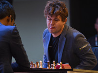 Chess players Rameshbabu Praggnanandhaa of India and Magnus Carlsen of Norway, a five-time World Chess Champion, compete on the first day of...