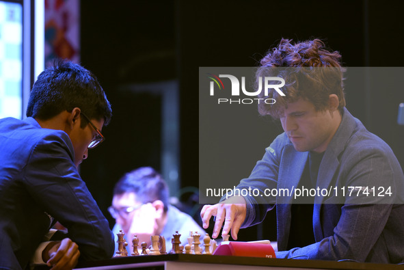 Chess players Rameshbabu Praggnanandhaa of India and Magnus Carlsen of Norway, a five-time World Chess Champion, compete on the first day of...