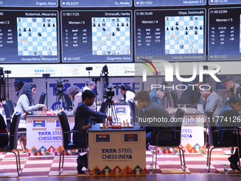 Chess players Rameshbabu Praggnanandhaa of India and Magnus Carlsen of Norway, a five-time World Chess Champion, compete on the first day of...