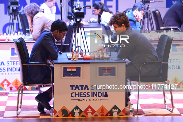 Chess players Rameshbabu Praggnanandhaa of India and Magnus Carlsen of Norway, a five-time World Chess Champion, compete on the first day of...