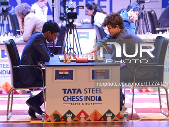 Chess players Rameshbabu Praggnanandhaa of India and Magnus Carlsen of Norway, a five-time World Chess Champion, compete on the first day of...