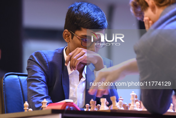 Chess player Rameshbabu Praggnanandhaa of India competes against Norway's Magnus Carlsen, five-time World Chess Champion, on the first day o...