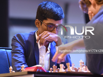 Chess player Rameshbabu Praggnanandhaa of India competes against Norway's Magnus Carlsen, five-time World Chess Champion, on the first day o...