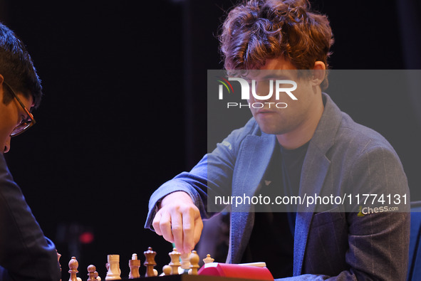 Chess player Magnus Carlsen from Norway, a five-time World Chess Champion, competes against Rameshbabu Praggnanandhaa on the first day of th...