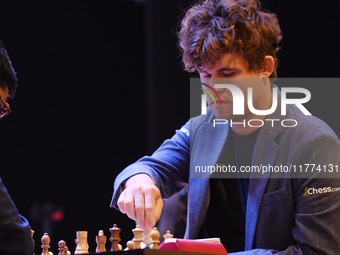 Chess player Magnus Carlsen from Norway, a five-time World Chess Champion, competes against Rameshbabu Praggnanandhaa on the first day of th...