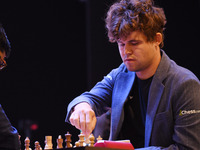 Chess player Magnus Carlsen from Norway, a five-time World Chess Champion, competes against Rameshbabu Praggnanandhaa on the first day of th...