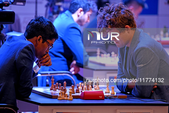 Chess players Rameshbabu Praggnanandhaa of India and Magnus Carlsen of Norway, a five-time World Chess Champion, compete on the first day of...