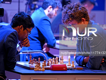 Chess players Rameshbabu Praggnanandhaa of India and Magnus Carlsen of Norway, a five-time World Chess Champion, compete on the first day of...