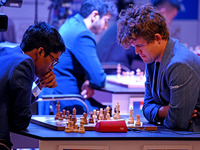 Chess players Rameshbabu Praggnanandhaa of India and Magnus Carlsen of Norway, a five-time World Chess Champion, compete on the first day of...