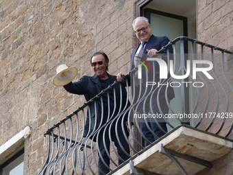 Antonello Venditti and Roberto Gualtieri look out from the balcony of the Campidoglio in Rome, Italy, on November 13, 2024. (