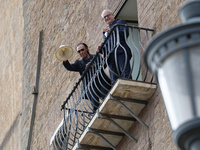 Antonello Venditti and Roberto Gualtieri look out from the balcony of the Campidoglio in Rome, Italy, on November 13, 2024. (