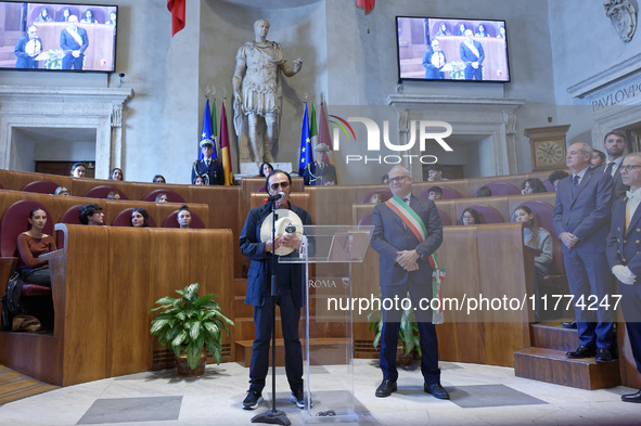 Italian singer-songwriter Antonello Venditti and Mayor of Rome Roberto Gualtieri attend the Capitoline Wolf award ceremony inside the Giulio...