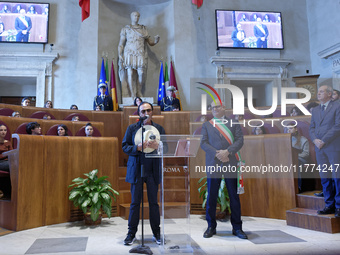 Italian singer-songwriter Antonello Venditti and Mayor of Rome Roberto Gualtieri attend the Capitoline Wolf award ceremony inside the Giulio...