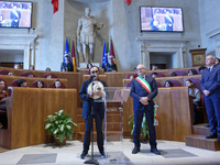 Italian singer-songwriter Antonello Venditti and Mayor of Rome Roberto Gualtieri attend the Capitoline Wolf award ceremony inside the Giulio...