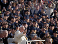 Pope Francis gives a thumbs-up gesture to the faithful and pilgrims during his Wednesday General Audience at St. Peter's Square in Vatican C...