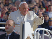 Pope Francis gives a thumbs-up gesture to the faithful and pilgrims during his Wednesday General Audience at St. Peter's Square in Vatican C...