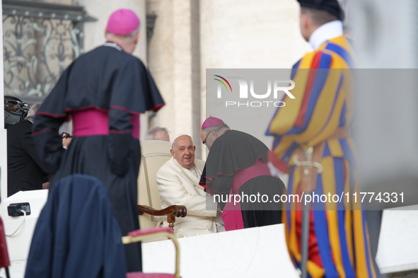 Pope Francis talks with a Cardinal at the end of his weekly General Audience at St. Peter's Square in Vatican City, on November 13, 2024. 