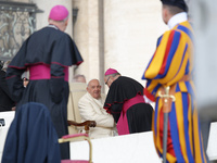 Pope Francis talks with a Cardinal at the end of his weekly General Audience at St. Peter's Square in Vatican City, on November 13, 2024. (