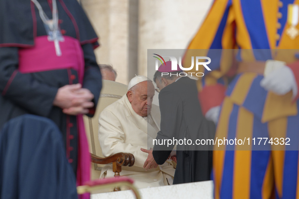 Pope Francis talks with a Cardinal at the end of his weekly General Audience at St. Peter's Square in Vatican City, on November 13, 2024. 